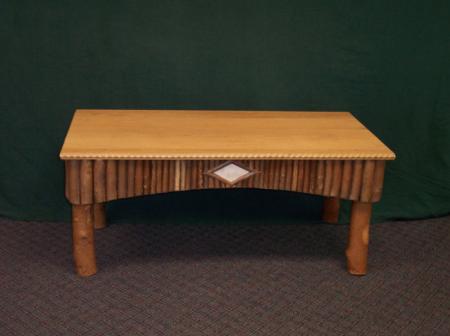 Oak top coffee table with twig sides and white birch bark detail.  $995