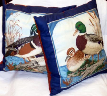 Duck pillows with rust color print on back, filled with polyester fiberfil. Constructed by Linda Monasky<br />