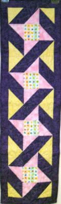 Friendship Star blocks,at the center of each block is a colorful egg print fabric. Table runner is constructed using quality 100% cotton fabric. Machine pieced and machine quilted by Linda Monasky <br />