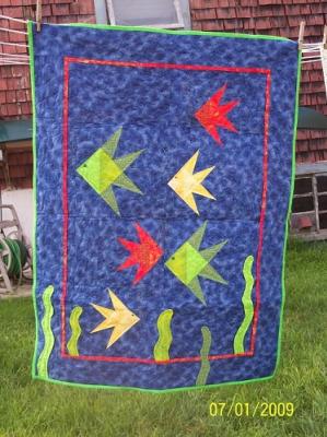 This wall hanging was made from an Eleanor Burns pattern. Top & backing are constructed of quality 100% cotton, batting is thin polyester.It was machine pieced and machine quilted by Linda Monasky