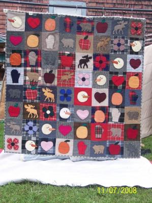 This quilt was hand appliqued, machine assembled and machine quilted by Linda Monasky. Dry cleaning is recommended.