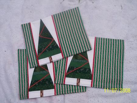 These placemats are made from strip pieced green 100% cotton fabrics to form the trees.Set of 6 may be sold separately.
