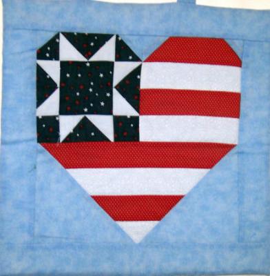 Flag Heart constructed using 100% cotton fabrics machine pieced and machine quilted by Linda Monasky <br />